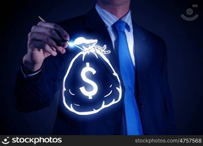 Money earning concept. Chest view of businessman drawing money bag on screen