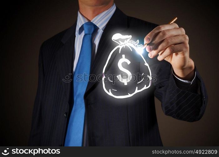 Money earning concept. Chest view of businessman drawing money bag on screen