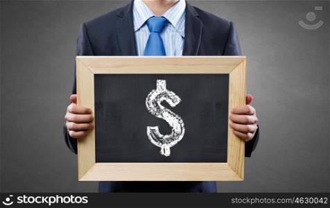 Money earning . Unrecognizable businessman holding blackboard with drawn dollar concept