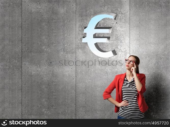 Money euro concept. Thinking woman in red jacket looking up on euro sign