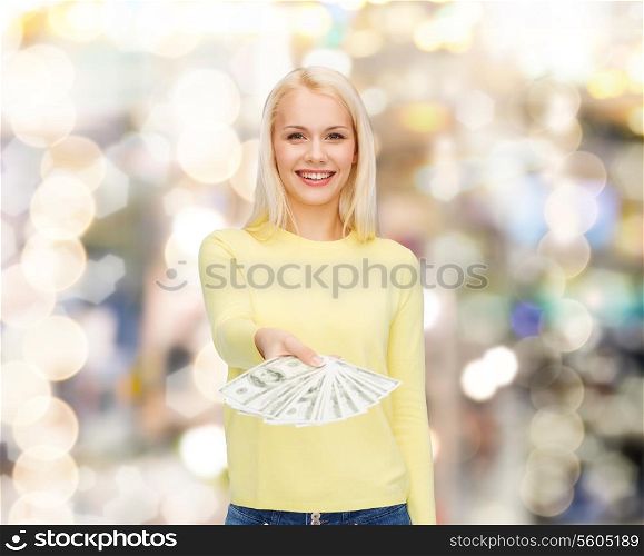 money, finances and people concept - smiling girl with dollar cash money