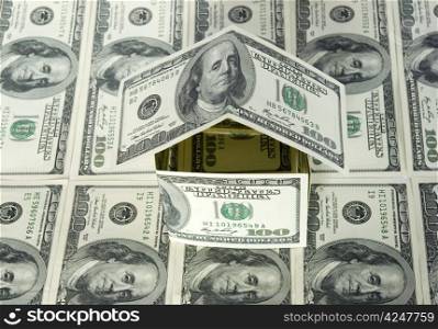 Money house on dollars background
