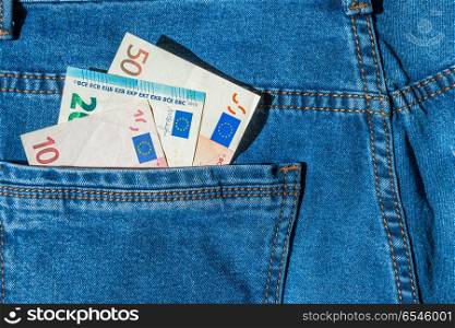 Money in blue jeans pocket- euro cash concept. Money in blue jeans pocket