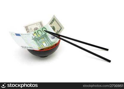 Money in red and black oriental bowl with chopsticks isolated