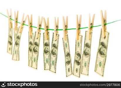 Money laundering concept with dollars on the rope