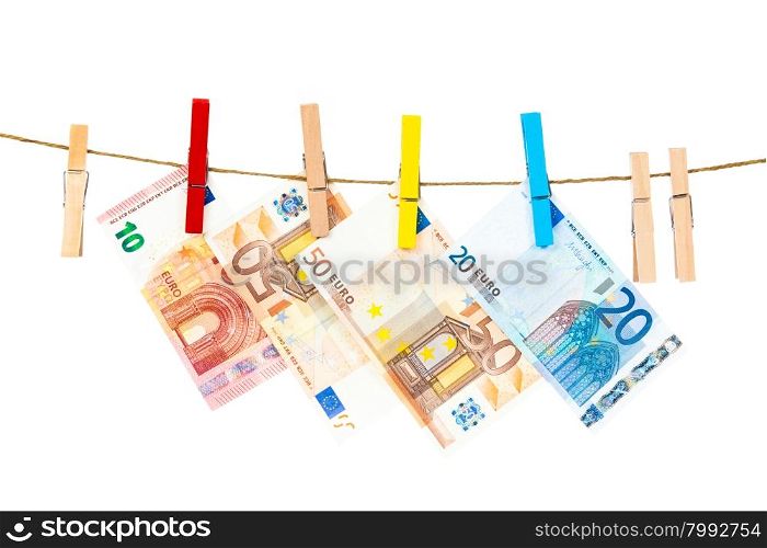Money laundering on clothesline isolated on white background. Euro banknotes hanging