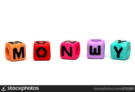 money - word made from multicolored child toy cubes with letters