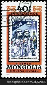 MONGOLIA - CIRCA 1980: A stamp printed in Mongolia showing stamp with cosmonauts A. Gubarev and V. Remek circa 1980