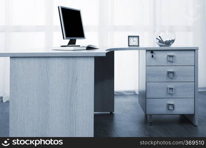 monitor on a desk in a modern office