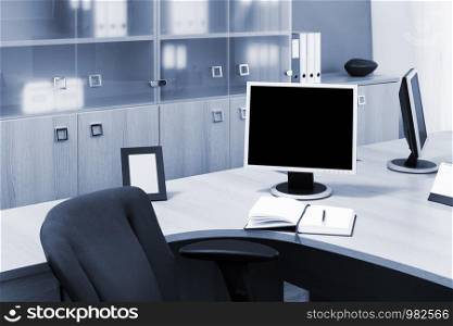 monitors on a desks in modern office