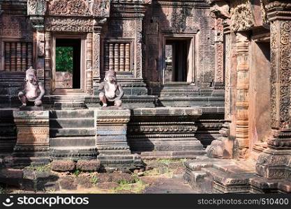 monkey gardians carvings at Banteay Srei red sandstone temple