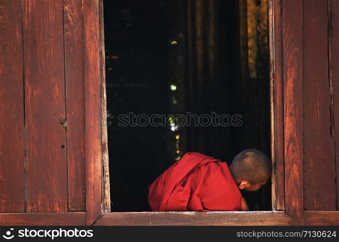 Monks sit at the window.