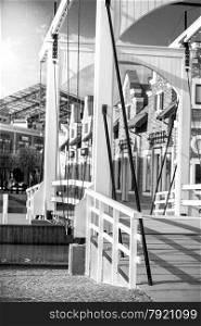 Monochrome photo of wooden drawbridge at Amsterdam