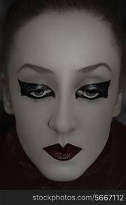 Monochrome Portrait of beautiful young woman with bright gothic makeup closeup