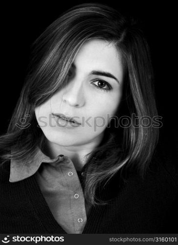 Monochrome portrait of woman on black