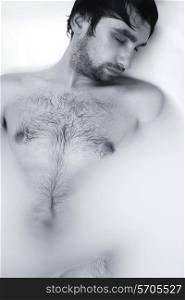 monochrome portrait of young sexual guy in the bath