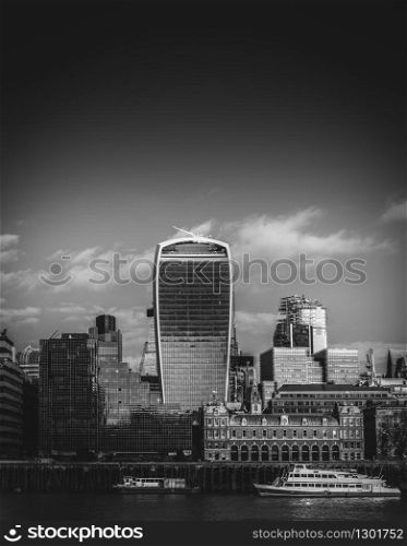 Monochrome River Thames and City of London financial district background with copy space. Monochrome River Thames and City of London financial district