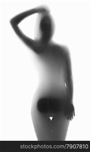 Monochrome silhouette photo of sexy naked woman leaning against glass
