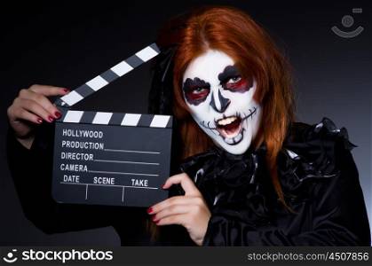 Monster with movie clapper board