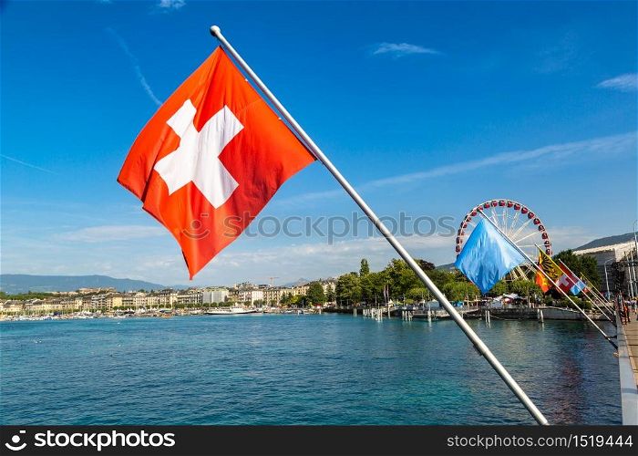 Mont Blanc bridge and Swiss flags over Geneva Lake in Geneva in a beautiful summer day, Switzerland