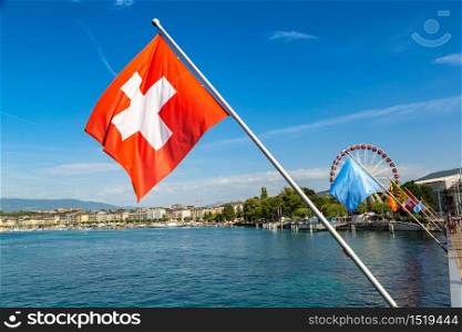 Mont Blanc bridge and Swiss flags over Geneva Lake in Geneva in a beautiful summer day, Switzerland