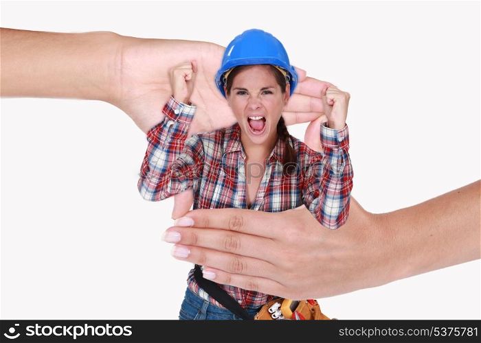 Montage of a screaming woman laborer