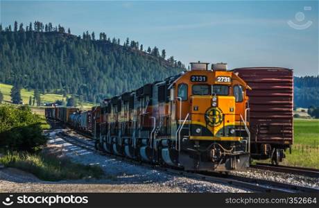 Montana landscapes with heavy train engine locomotive passing