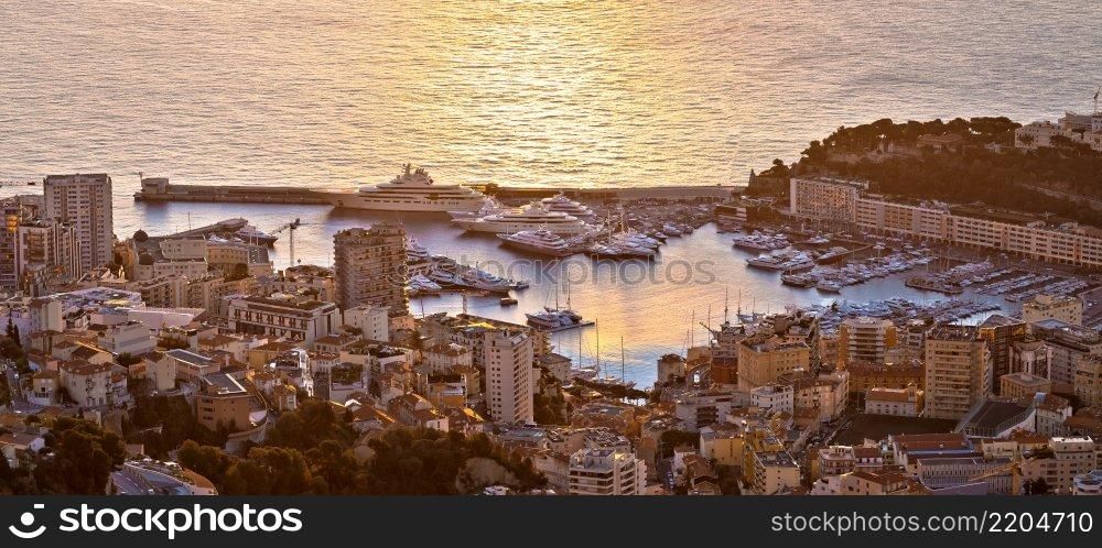Monte Carlo luxury yacht harbor Port Hercules aerial sunrise view, Principality of Monaco