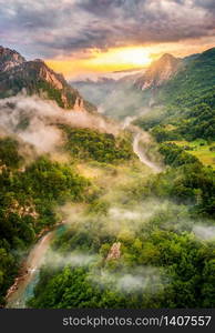 Montenegro,mountains and of sunset sky over world famous tara river. Canyon near city Zabljak. Famous Tara river