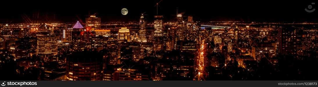 Montreal downtown buildings at night. Night city panorama skyline. View from Mount-Royal. Canada.