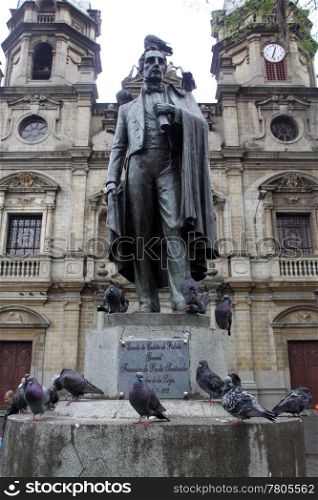 monument and pigeons on the street in Medelyn in Colombia