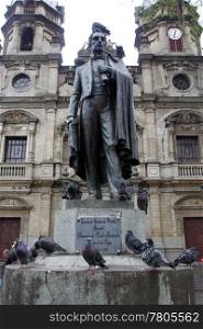 monument and pigeons on the street in Medelyn in Colombia