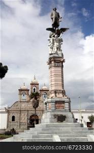 Monument near church on the square in Riobamba, Ecuador