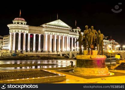 Monument of the Boatmen of Salonica and Museum of archeology in Skopje in a beautiful summer nigh, Macedonia