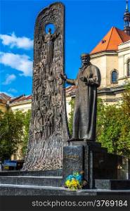 monument to poet Taras Shevchenko, church of Saint Peter and Paul and tower of town hall in Lvov, Ukraine. Monument has been erected in 1992.