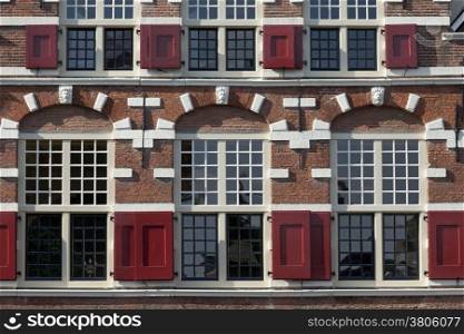 Monumental facade with window shutters in Leiden, Netherlands