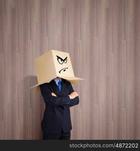 Mood change. Businessman with box on head showing different emotions