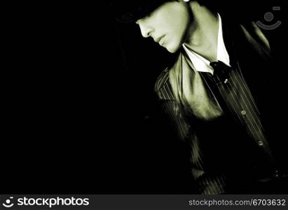 Moody image of a well dressed man.