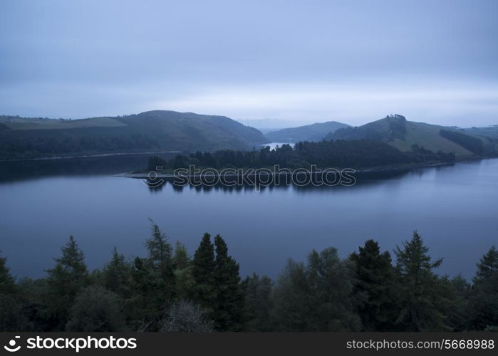 Moody landscape image of lake pre-dawn in Autumn