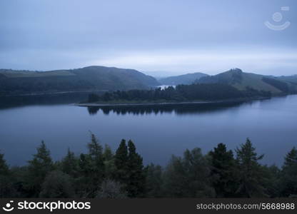 Moody landscape image of lake pre-dawn in Autumn