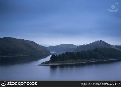Moody landscape image of lake pre-dawn in Autumn