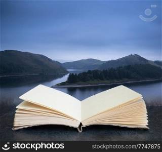Moody landscape image of lake pre-dawn in Autumn in pages of imaginary reading book