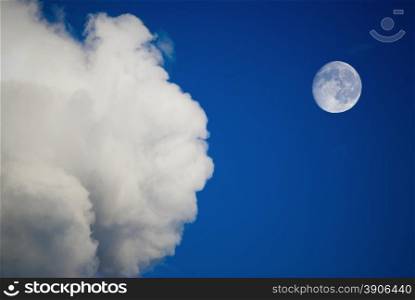 moon and clouds on the blue sky