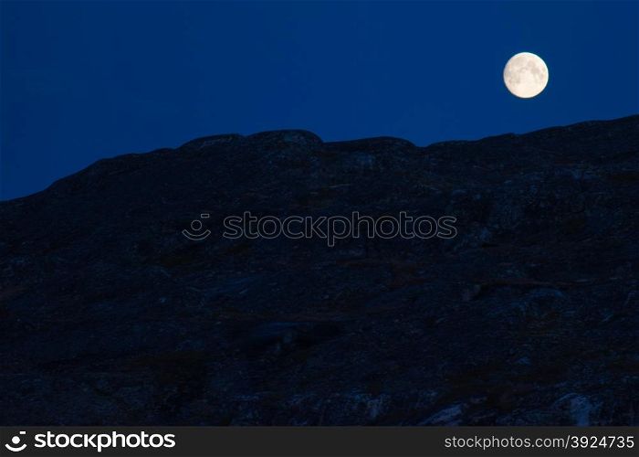 Moon and rocks. Moon at night with rocky surface in the forground