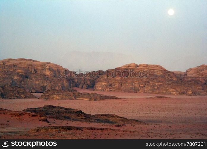 Moon and Wadi Rum desert in Jordan