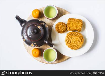 Moon cake and tea for Chinese mid autumn festival. Isolated on white. Copy space