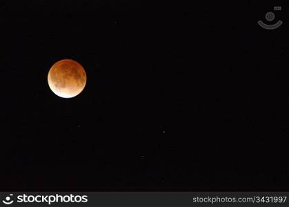 Moon during lunar eclipse. Red moon during a lunar eclipse on a black sky