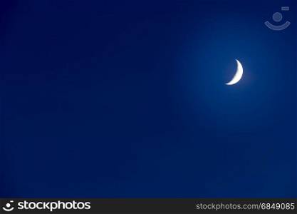 Moon on a dark blue sky. Copy Space for your text.
