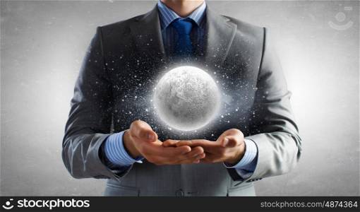 Moon planet. Close of businessman hands holding moon planet