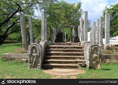 Moon stone and columns of temple in Anuradhapura, Sri Lanka